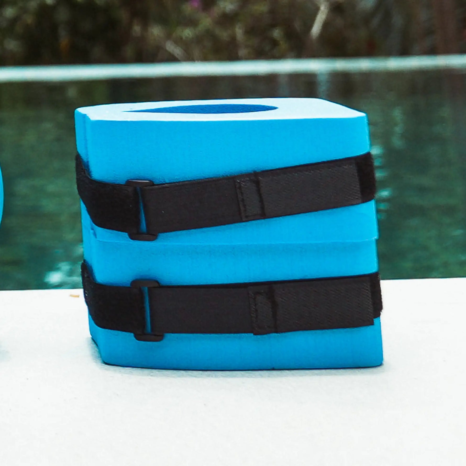 Pair of aquafitness ankle dumbbells with support straps.